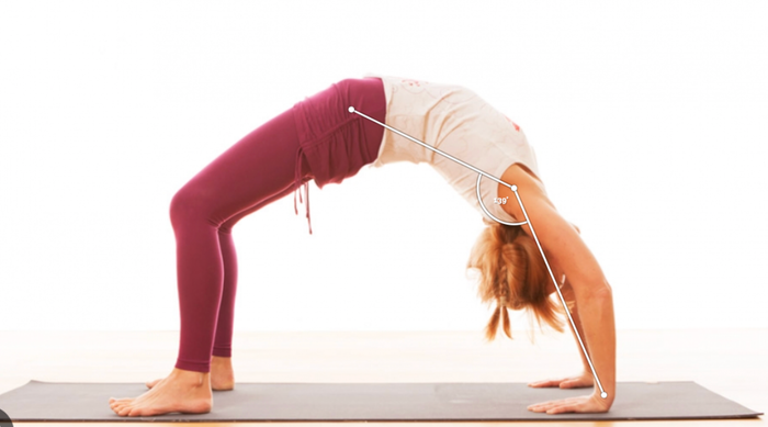 A woman does a yoga pose called Setu Bandha Sarvangasana, also known as the King Pigeon Pose. Overlaid on the image by Pose Estimation shows dots and lines on PoseTracker landmarks.